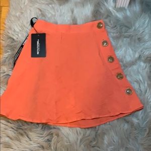 Peach spice button mini skirt